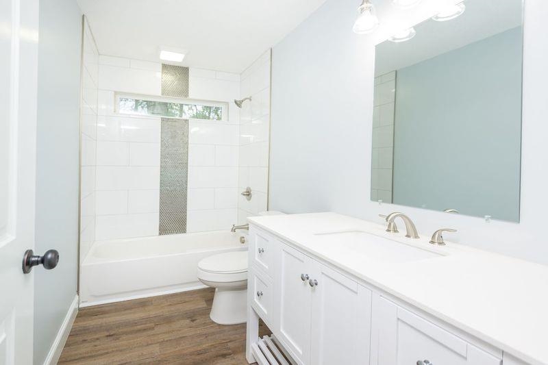 2943 North 6th Street St. Augustine, FL 32084 - Photo 12 of 17 a bathroom with a sink a toilet and shower