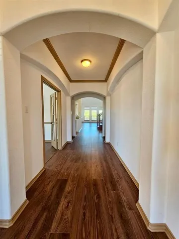 a view of entryway with wooden floor