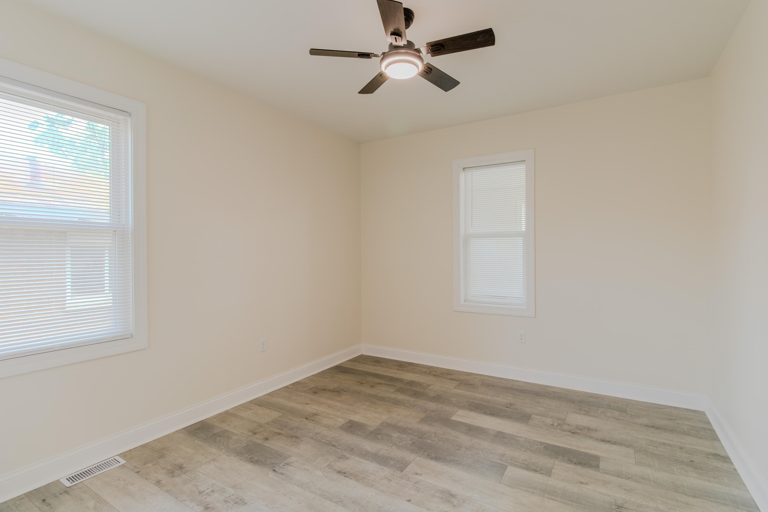 3678 Jackson Street Gary, IN 46408 - Photo 10 of 27 an empty room with a window and a fan