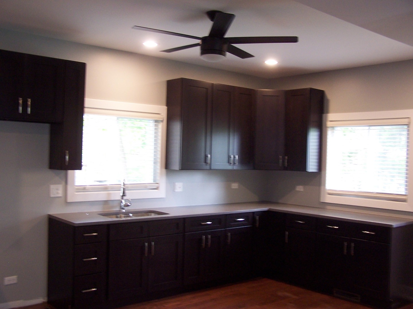 604 Clement Street Joliet, IL 60435 - Photo 2 of 17 a kitchen with a sink a window and cabinets