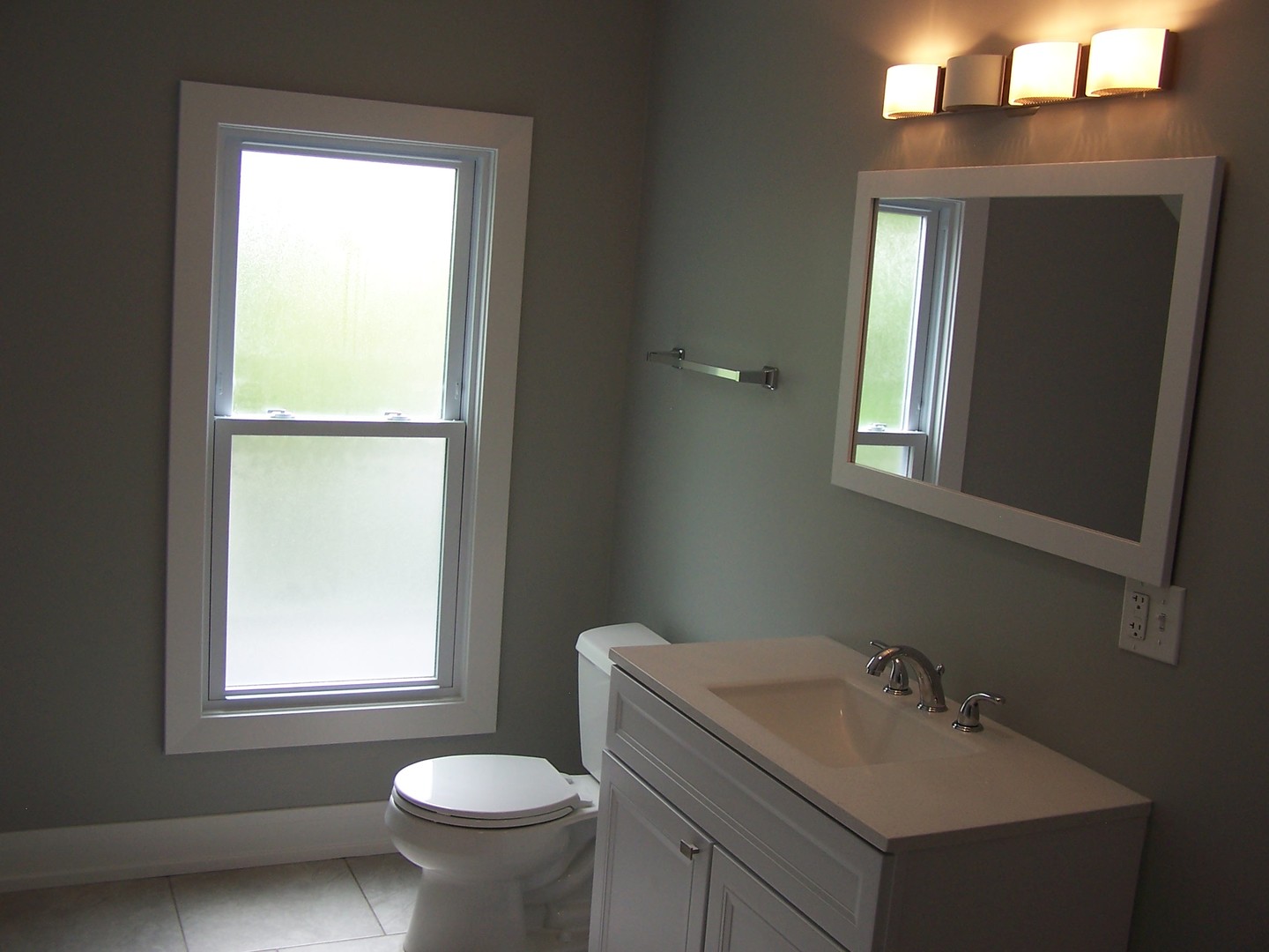 604 Clement Street Joliet, IL 60435 - Photo 12 of 17 a bathroom with a toilet sink and mirror