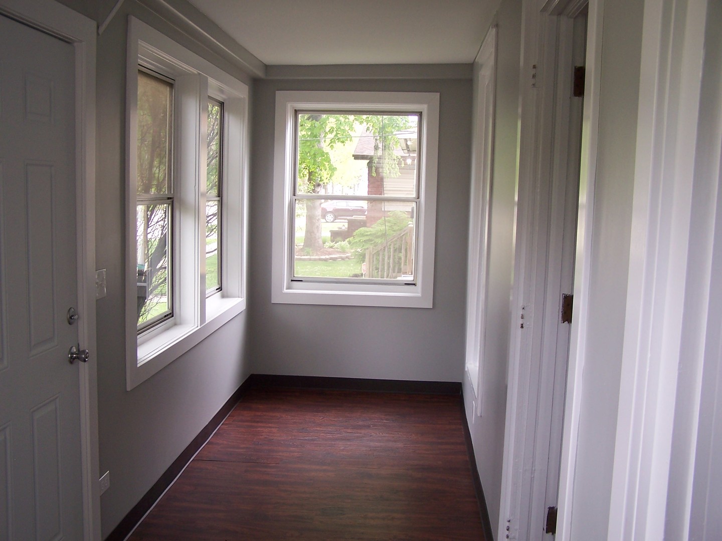 604 Clement Street Joliet, IL 60435 - Photo 7 of 17 a view of an empty room with a window