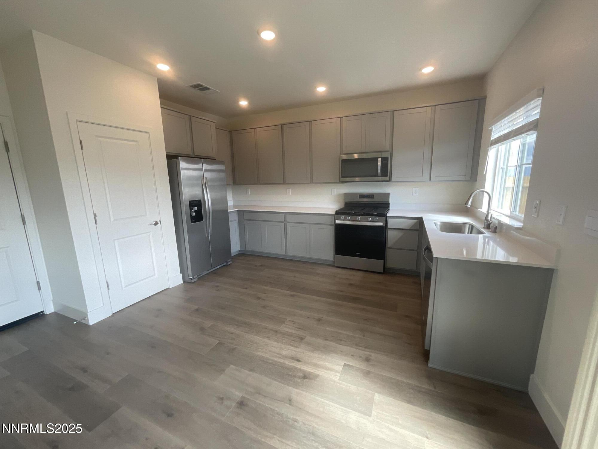 4128 Scenic Drive Reno, NV 89523 - Photo 3 of 20 a kitchen with refrigerator and window