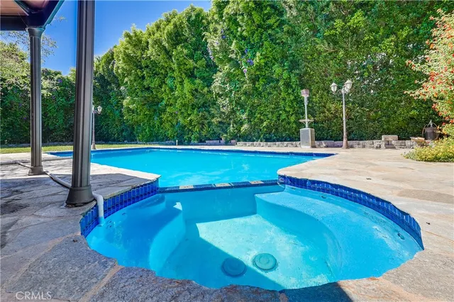 a view of a swimming pool with an outdoor space