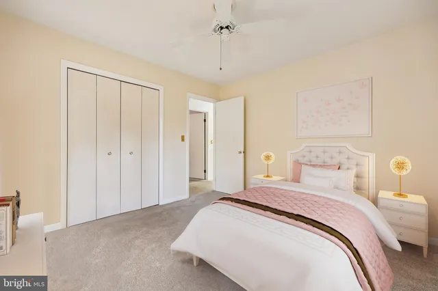 a spacious bedroom with a bed and a window