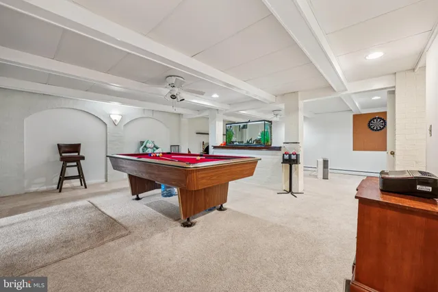 a room with furniture and air hockey table