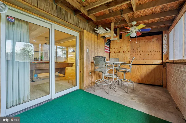 a view of a chairs and table in a patio