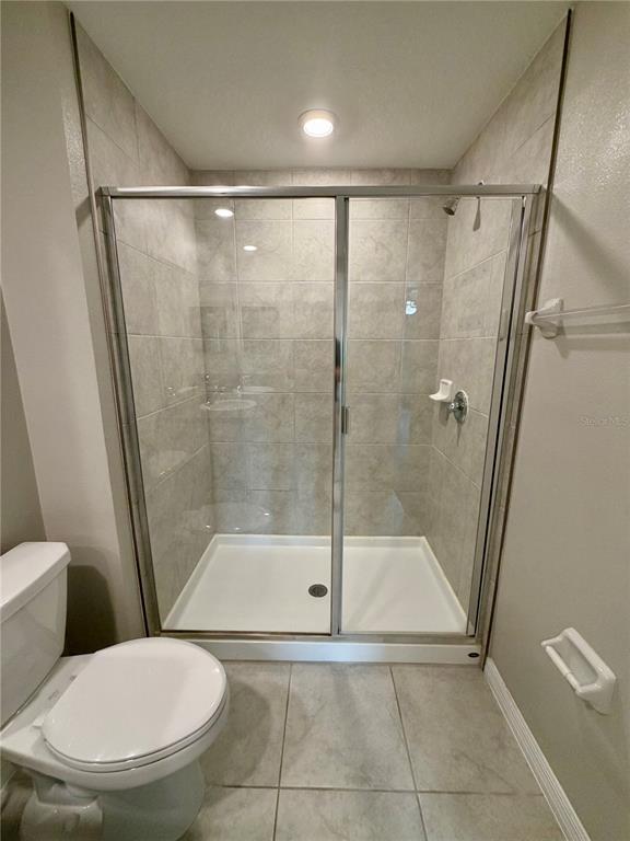 11826 Dumaine Valley Road Riverview, FL 33579 - Photo 28 of 54 a bathroom with a toilet and a shower