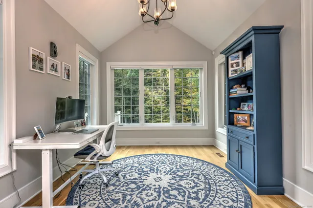 a workspace with furniture and window