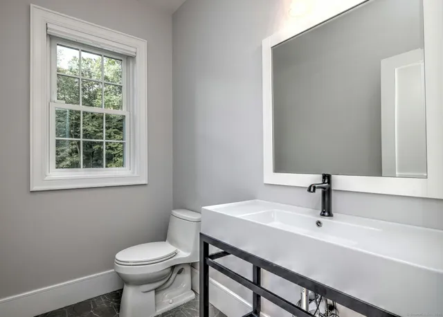 a bathroom with a sink and a toilet