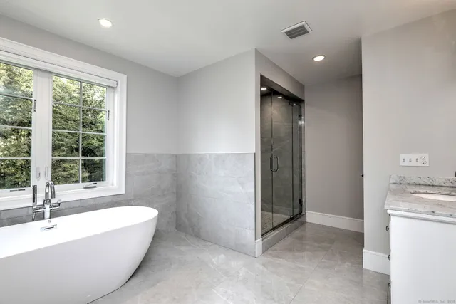 a bathroom with a bathtub and a sink