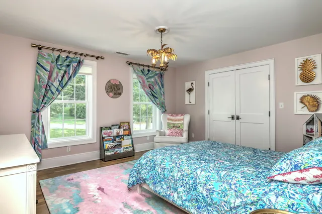 a bedroom with bed and a window