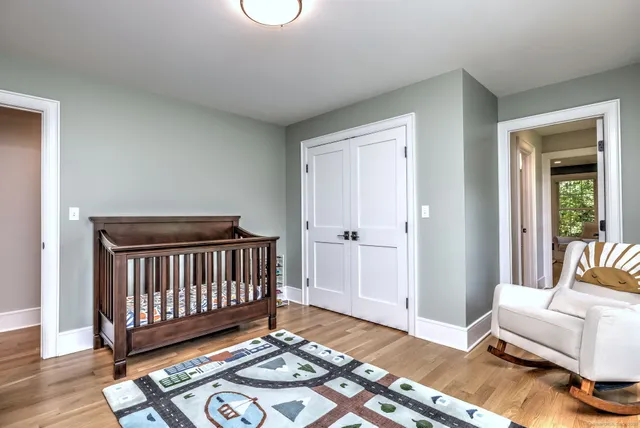 a room with a couch and a dining table