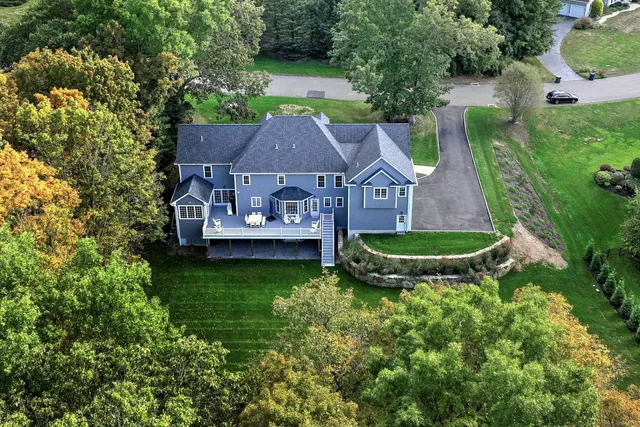 an aerial view of a house with a garden