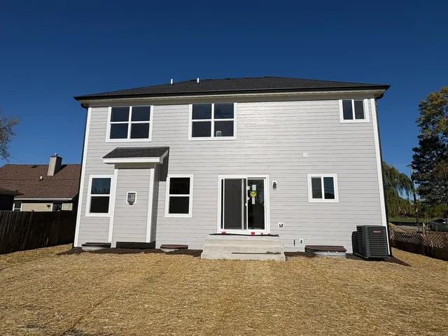 a house that has a large window in front of it