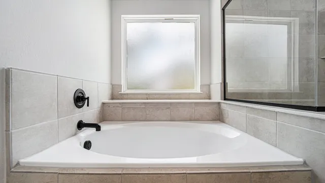 a bathroom with bathtub