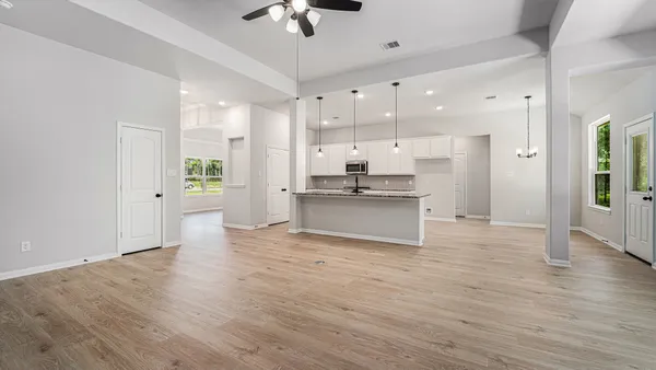 a view of kitchen with wooden floor