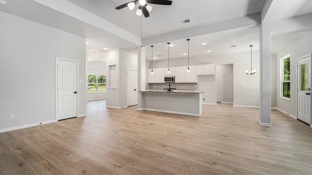 a view of kitchen with wooden floor