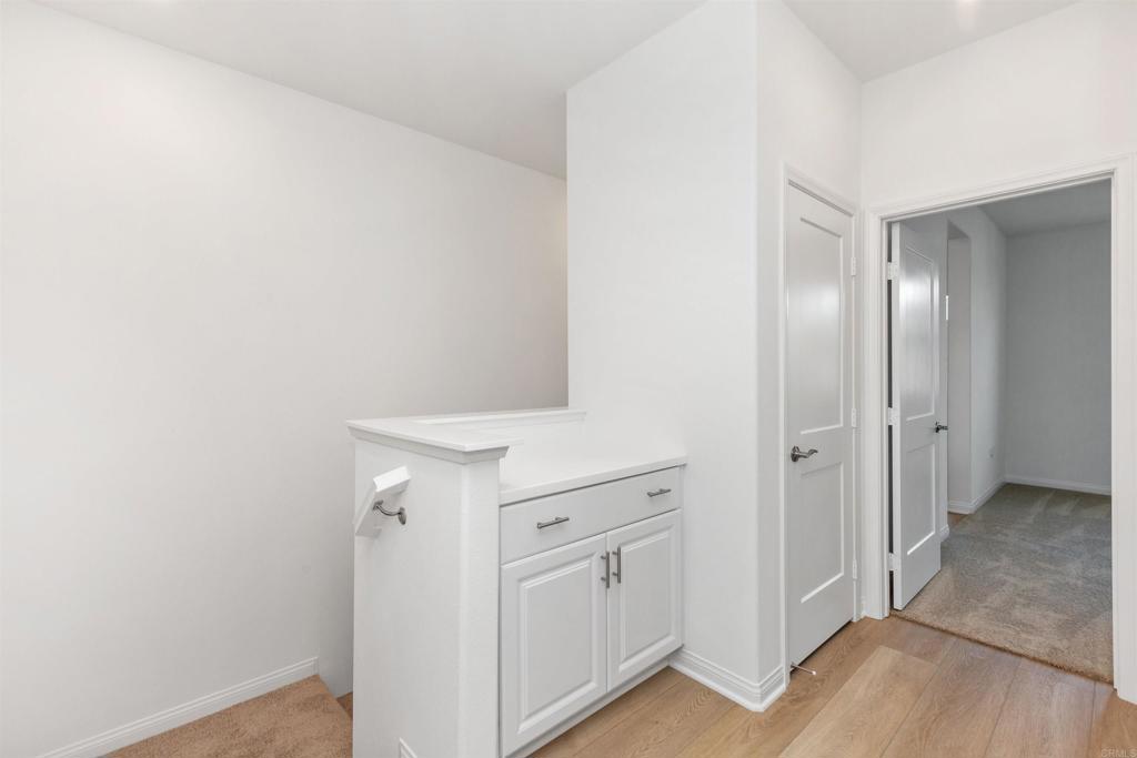 1532 Redbud Way Oceanside, CA 92056 - Photo 11 of 40 a view of a hallway with closet