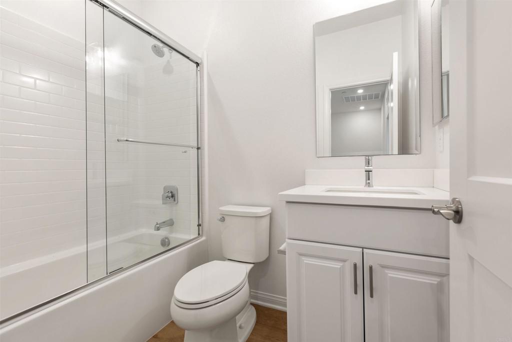 1532 Redbud Way Oceanside, CA 92056 - Photo 13 of 40 a bathroom with a sink toilet and shower