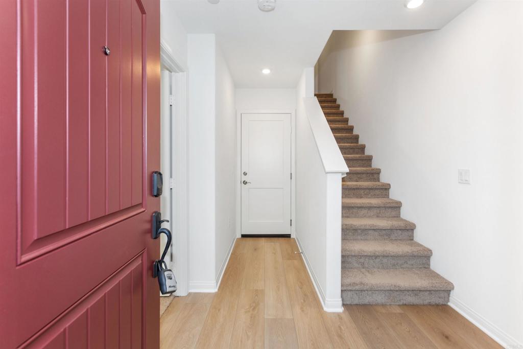 1532 Redbud Way Oceanside, CA 92056 - Photo 21 of 40 a view of a hallway with wooden floor and entryway
