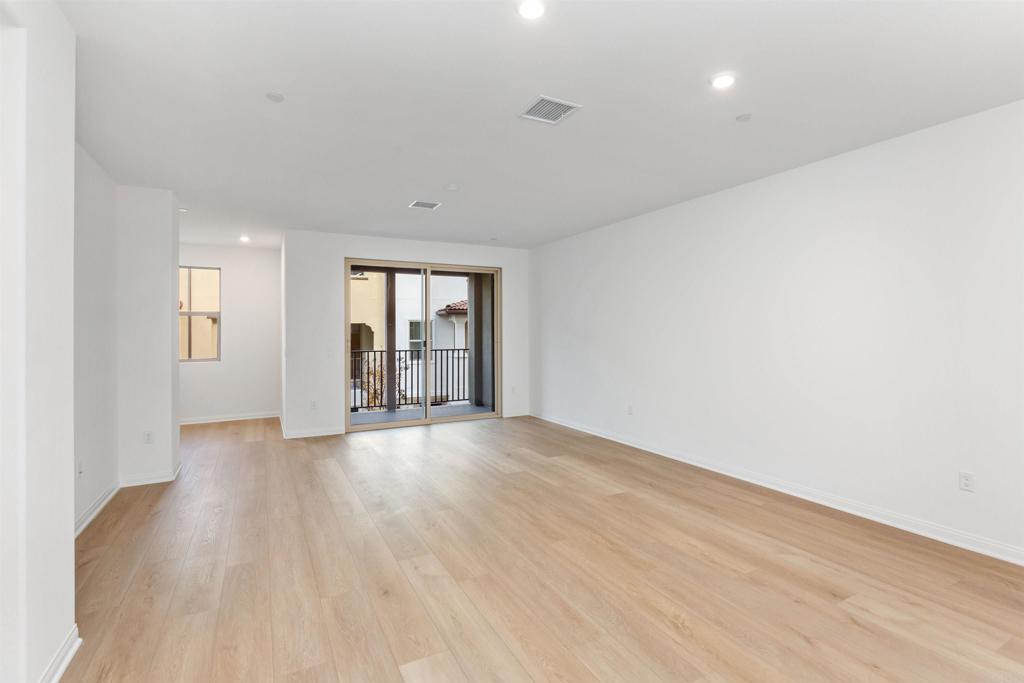 1532 Redbud Way Oceanside, CA 92056 - Photo 25 of 40 wooden floor in an empty room with a window