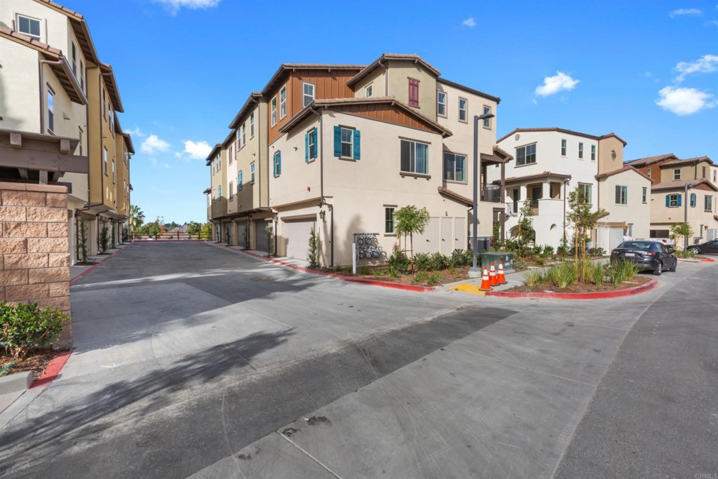 1532 Redbud Way Oceanside, CA 92056 - Photo 30 of 40 a front view of a white building