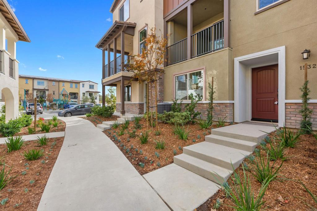 1532 Redbud Way Oceanside, CA 92056 - Photo 40 of 40 a view of a building with a yard and plants