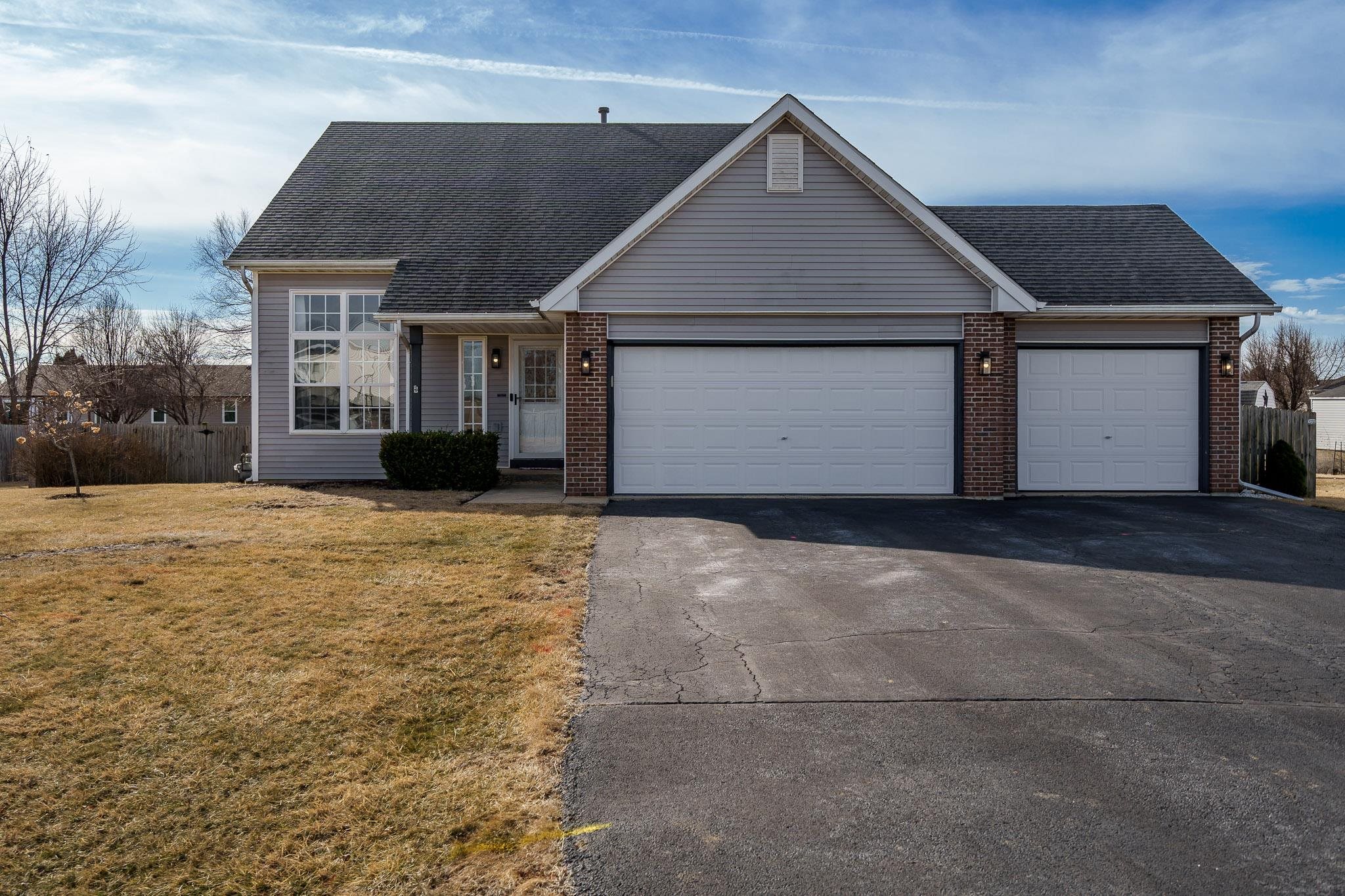 148 Prairie Moon Drive Davis Junction, IL 61020 - Photo 1 of 33 a front view of house with yard and garage