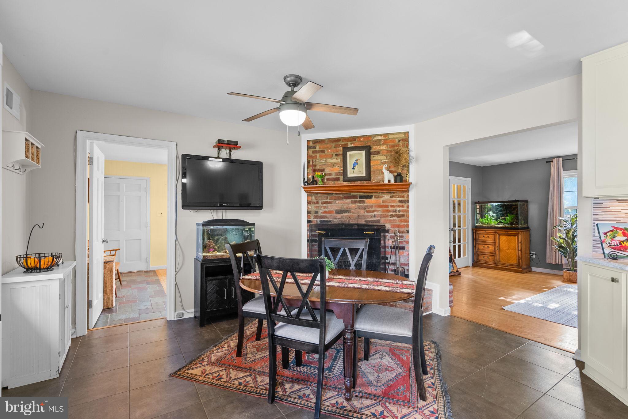 14530 Sturtevant Road Silver Spring, MD 20905 - Photo 13 of 47 a dining room with furniture and wooden floor