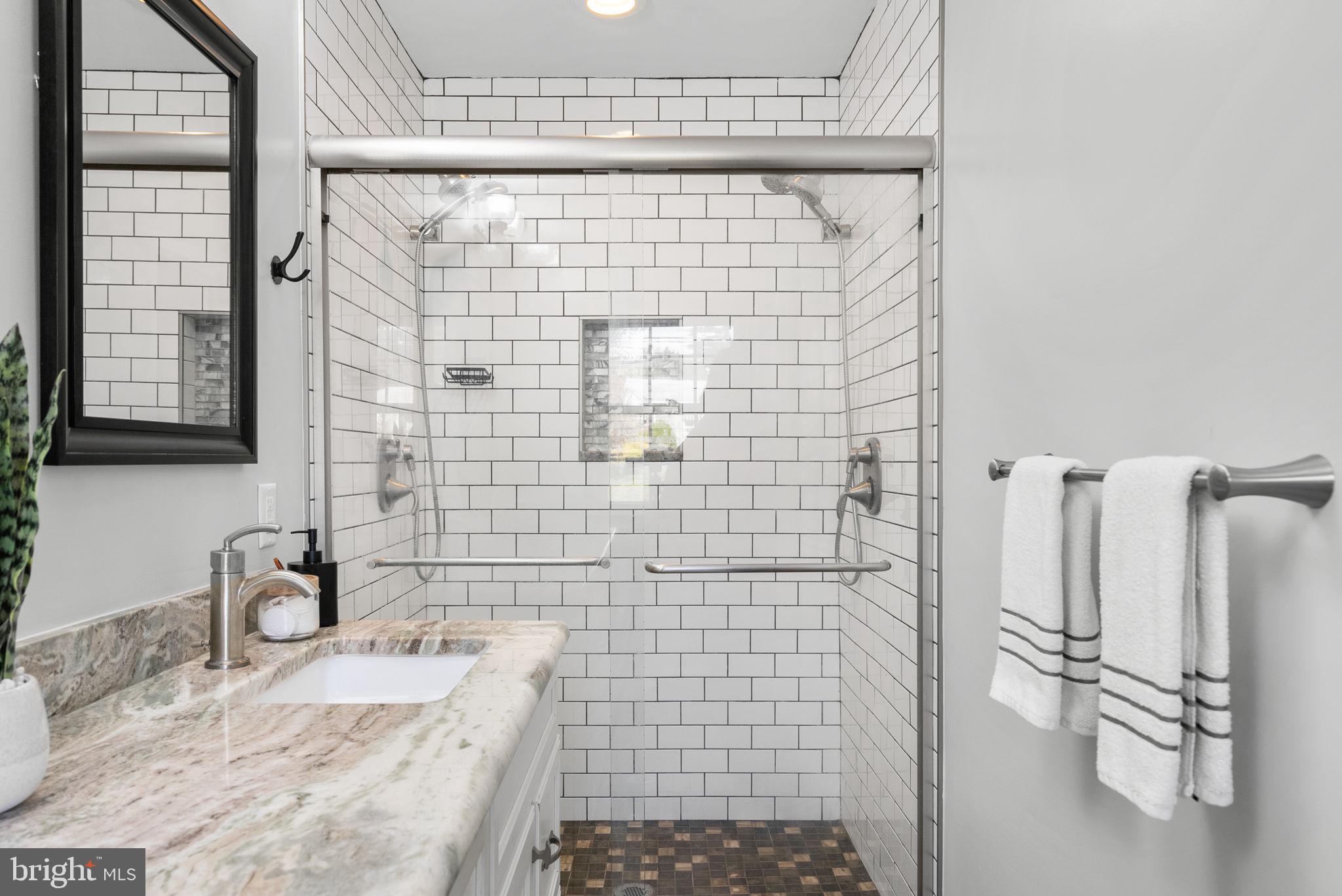 14530 Sturtevant Road Silver Spring, MD 20905 - Photo 21 of 47 a bathroom with a sink a toilet and shower