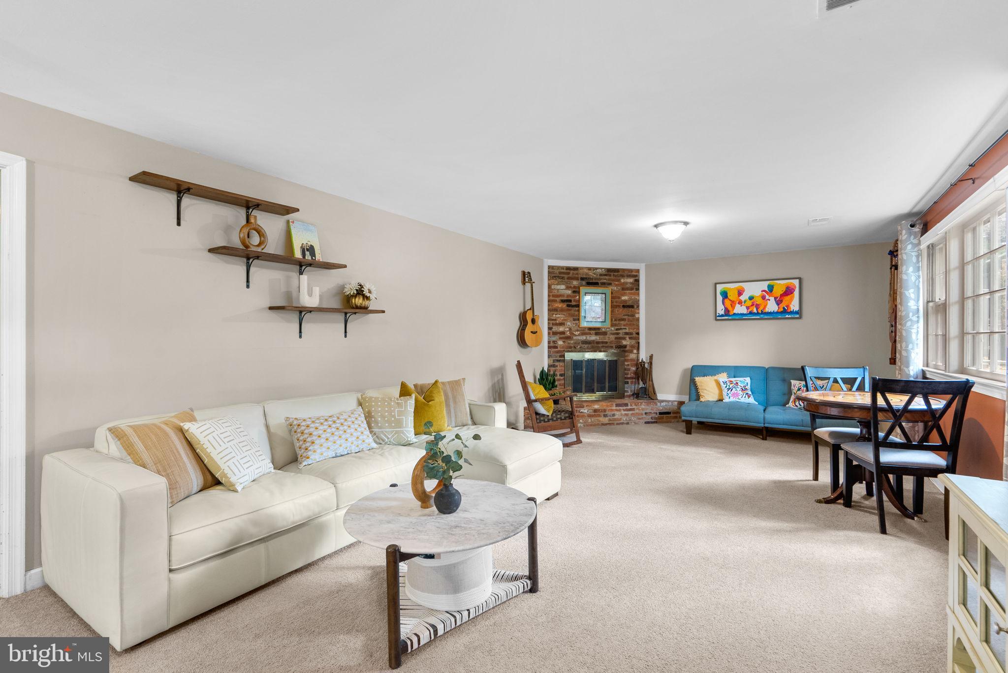 14530 Sturtevant Road Silver Spring, MD 20905 - Photo 30 of 47 a living room with furniture and a table