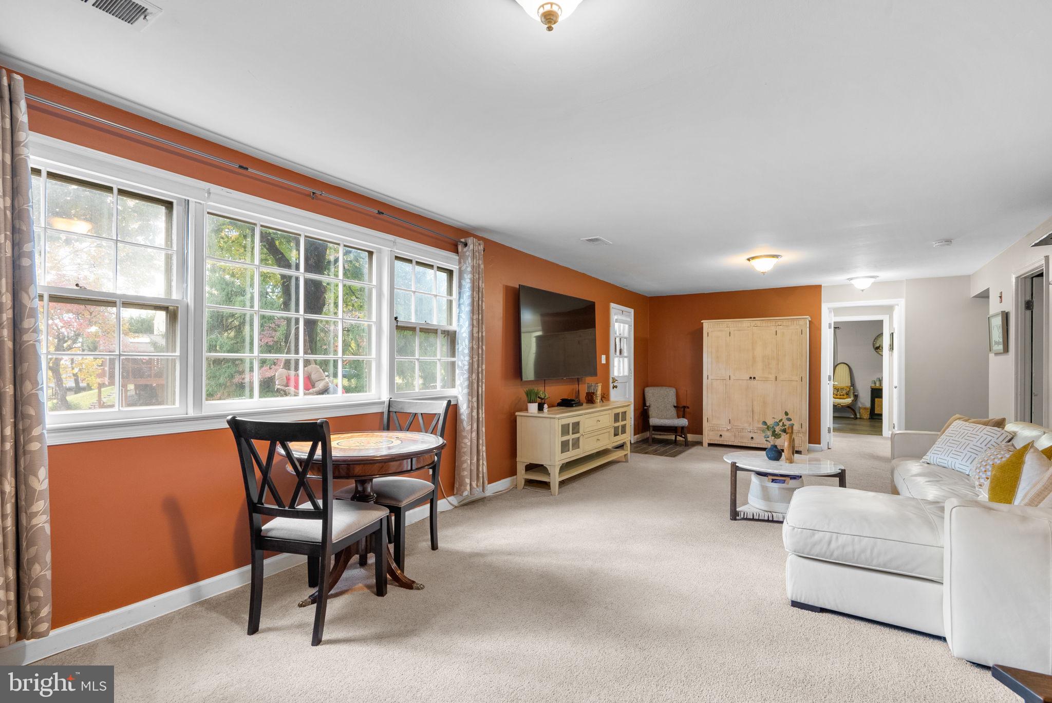 14530 Sturtevant Road Silver Spring, MD 20905 - Photo 32 of 47 a living room with furniture and large windows