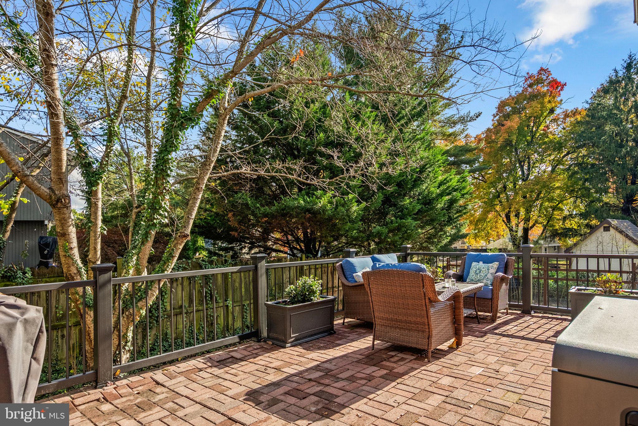 14530 Sturtevant Road Silver Spring, MD 20905 - Photo 42 of 47 a backyard of a house with barbeque oven and outdoor seating