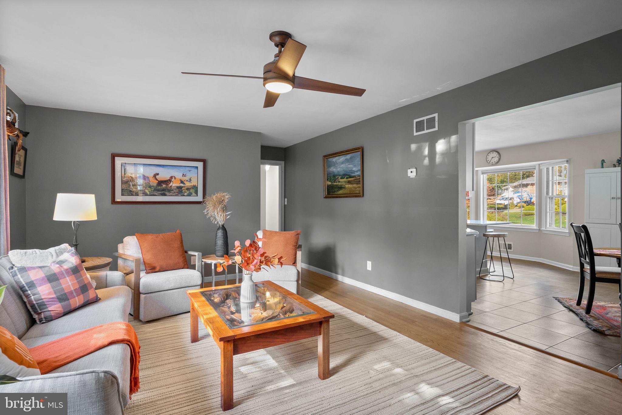 14530 Sturtevant Road Silver Spring, MD 20905 - Photo 6 of 47 a living room with furniture a rug and a window