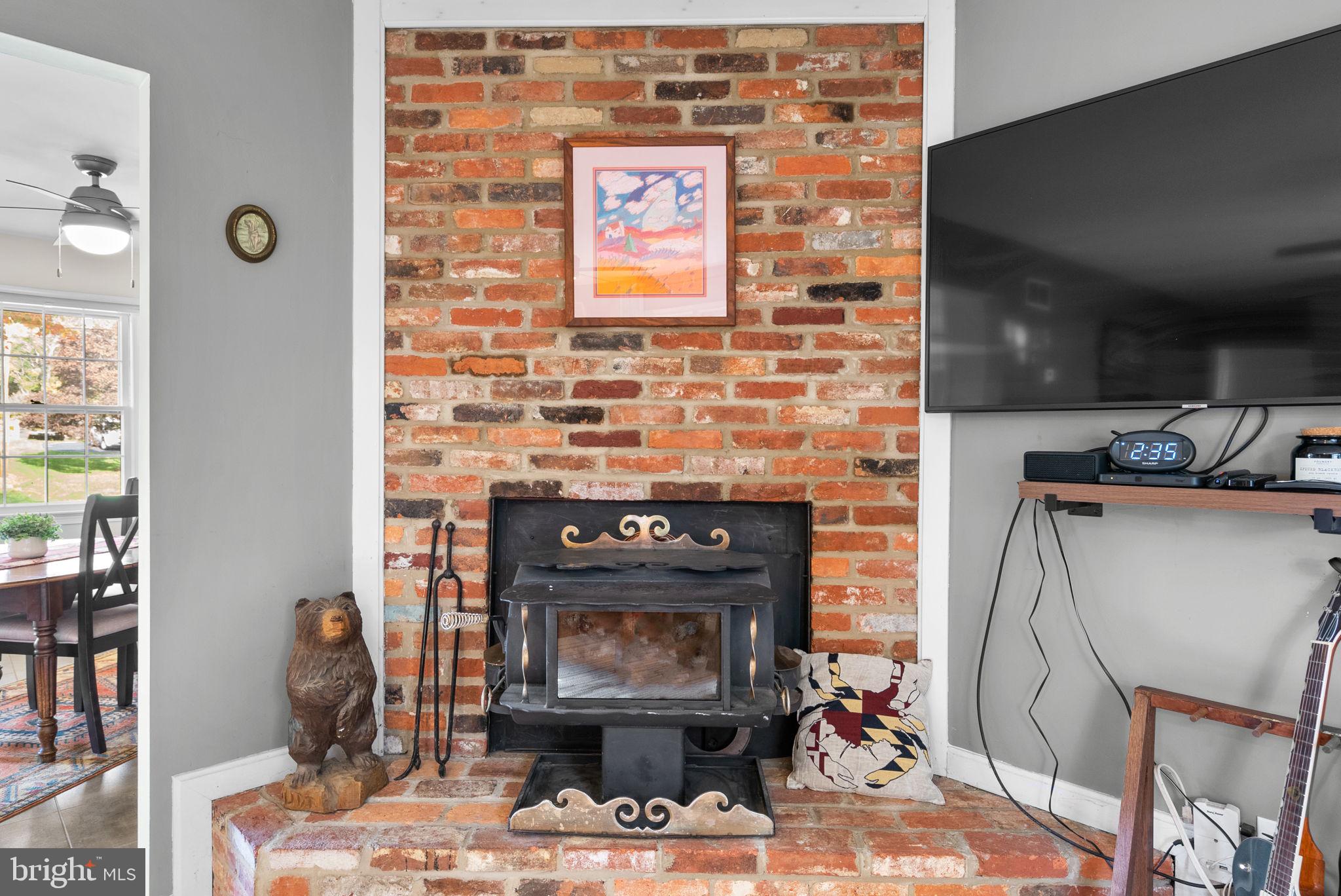14530 Sturtevant Road Silver Spring, MD 20905 - Photo 7 of 47 a dining room with fireplace furniture and a window