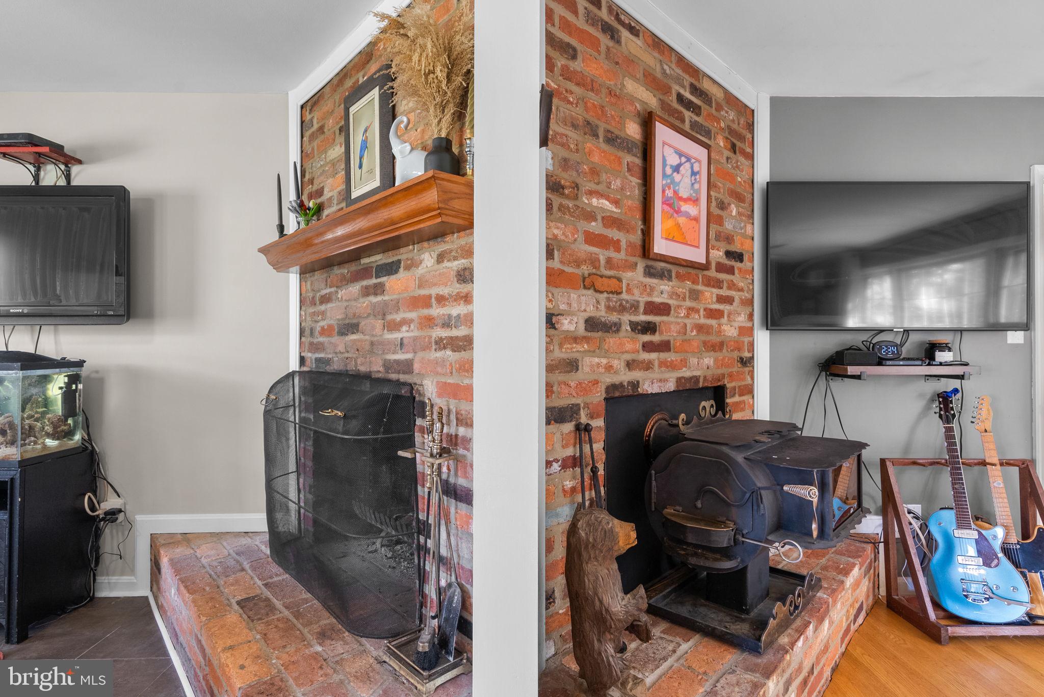 14530 Sturtevant Road Silver Spring, MD 20905 - Photo 8 of 47 a room with furniture a flat screen tv and a fireplace