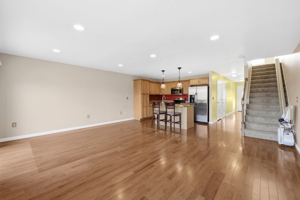 353 Fuller Street, Unit 8 Ludlow, MA 01056 - Photo 13 of 41 a view of dining room with furniture and wooden floor