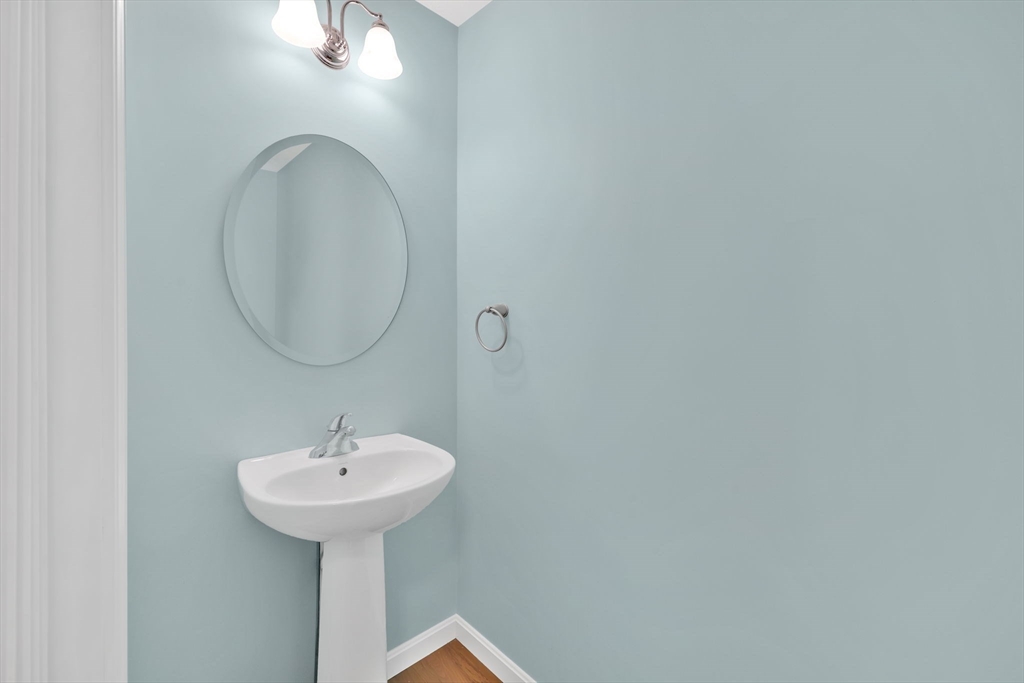 353 Fuller Street, Unit 8 Ludlow, MA 01056 - Photo 16 of 41 a bathroom with a sink and a mirror