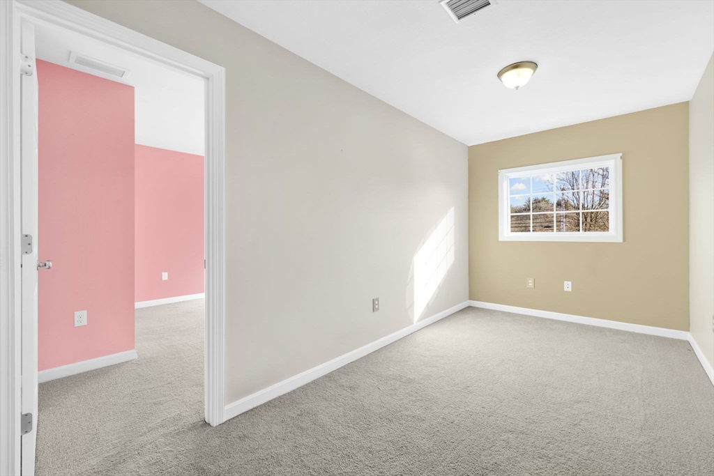 353 Fuller Street, Unit 8 Ludlow, MA 01056 - Photo 17 of 41 an empty room with windows