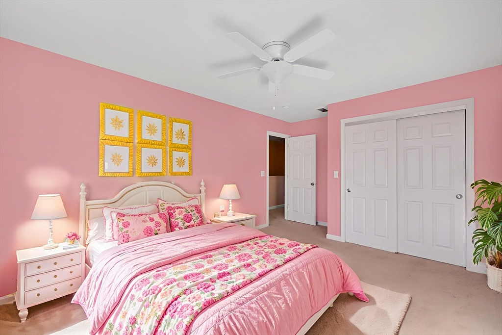 353 Fuller Street, Unit 8 Ludlow, MA 01056 - Photo 18 of 41 a bedroom with a bed and a potted plant