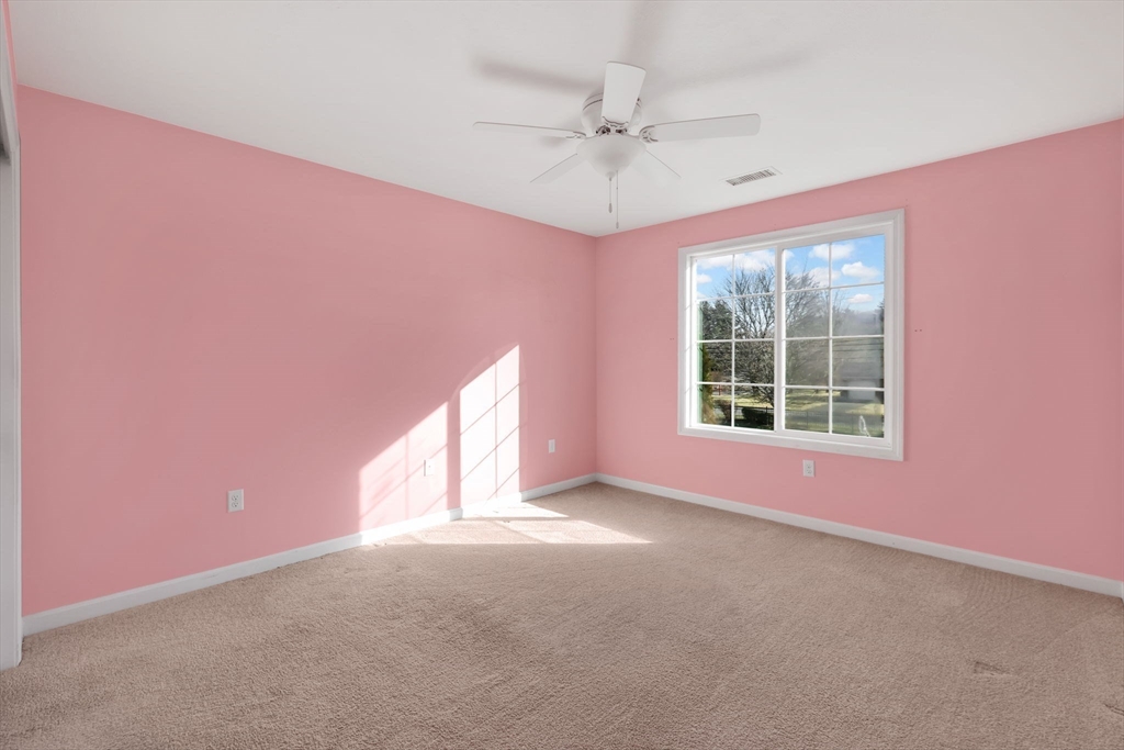 353 Fuller Street, Unit 8 Ludlow, MA 01056 - Photo 20 of 41 a view of a livingroom with a ceiling fan and window