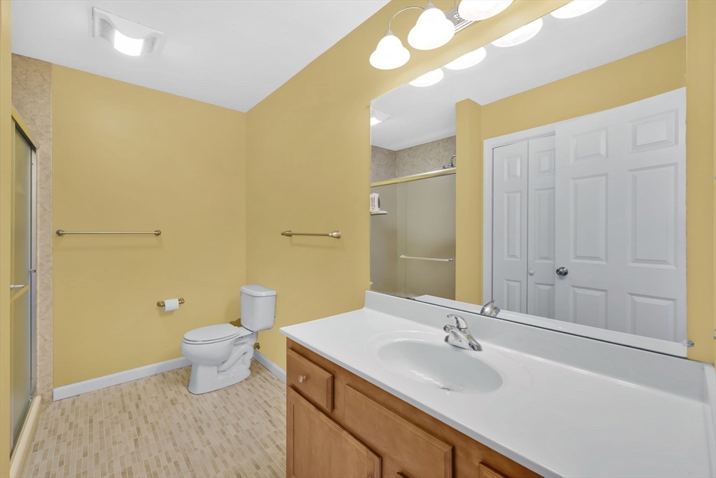 353 Fuller Street, Unit 8 Ludlow, MA 01056 - Photo 26 of 41 a bathroom with a sink and a mirror