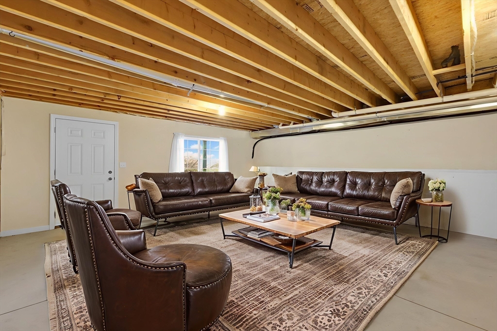 353 Fuller Street, Unit 8 Ludlow, MA 01056 - Photo 29 of 41 a living room with furniture and wooden floor