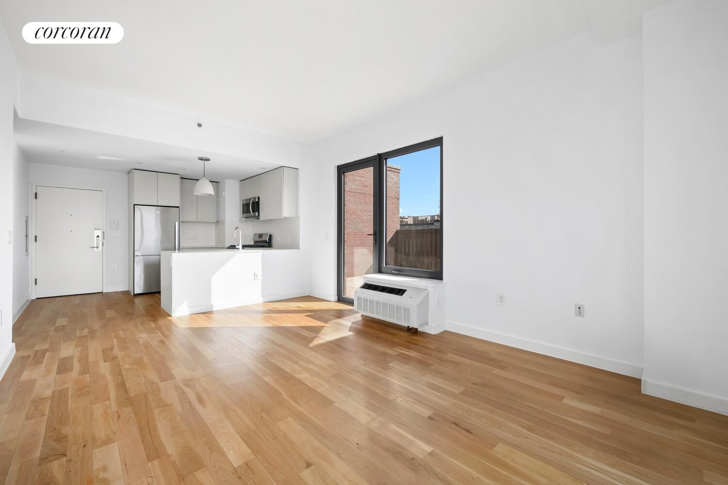 123 Hope Street, Unit 7R Brooklyn, NY 11211 - Photo 5 of 15 a view of a kitchen with a sink and a window