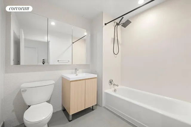 a bathroom with a toilet sink and a bathtub