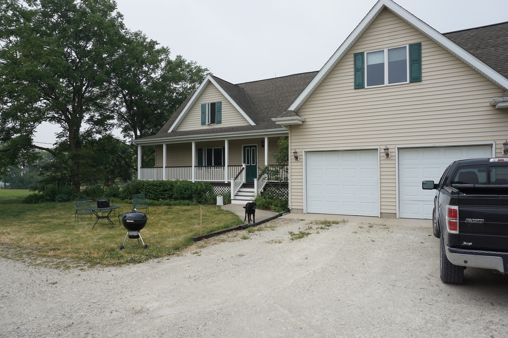 15716 West Arsenal Road Manhattan, IL 60442 - Photo 8 of 36 a view of house and fire pit