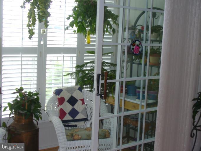 131 Fort Evans Road Southeast, Unit E Leesburg, VA 20175 - Photo 14 of 23 Sunny SunRoom