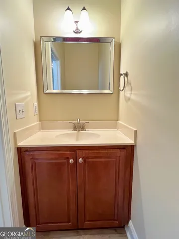 a bathroom with a sink and a mirror