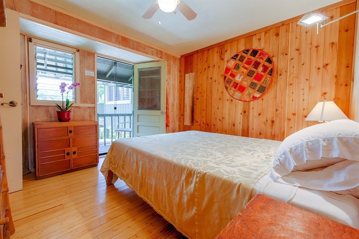 4467 Mahimahi Road Hanalei, HI 96714 - Photo 27 of 30 a bed sitting in a bedroom next to a window
